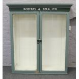 A Victorian bookcase later painted and stencilled for Roberts & Belk Ltd Silversmiths.