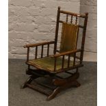 An Edwardian childs mahogany rocking chair.