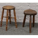 Two antique stools including a tripod stool with exposed tenons.
