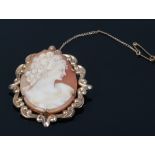 A 9ct gold shell cameo brooch portrait of a maiden, makers mark for WJP with safety chain.