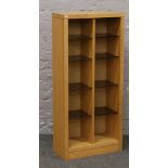 A modern light oak shelving unit with smoked glass shelves.