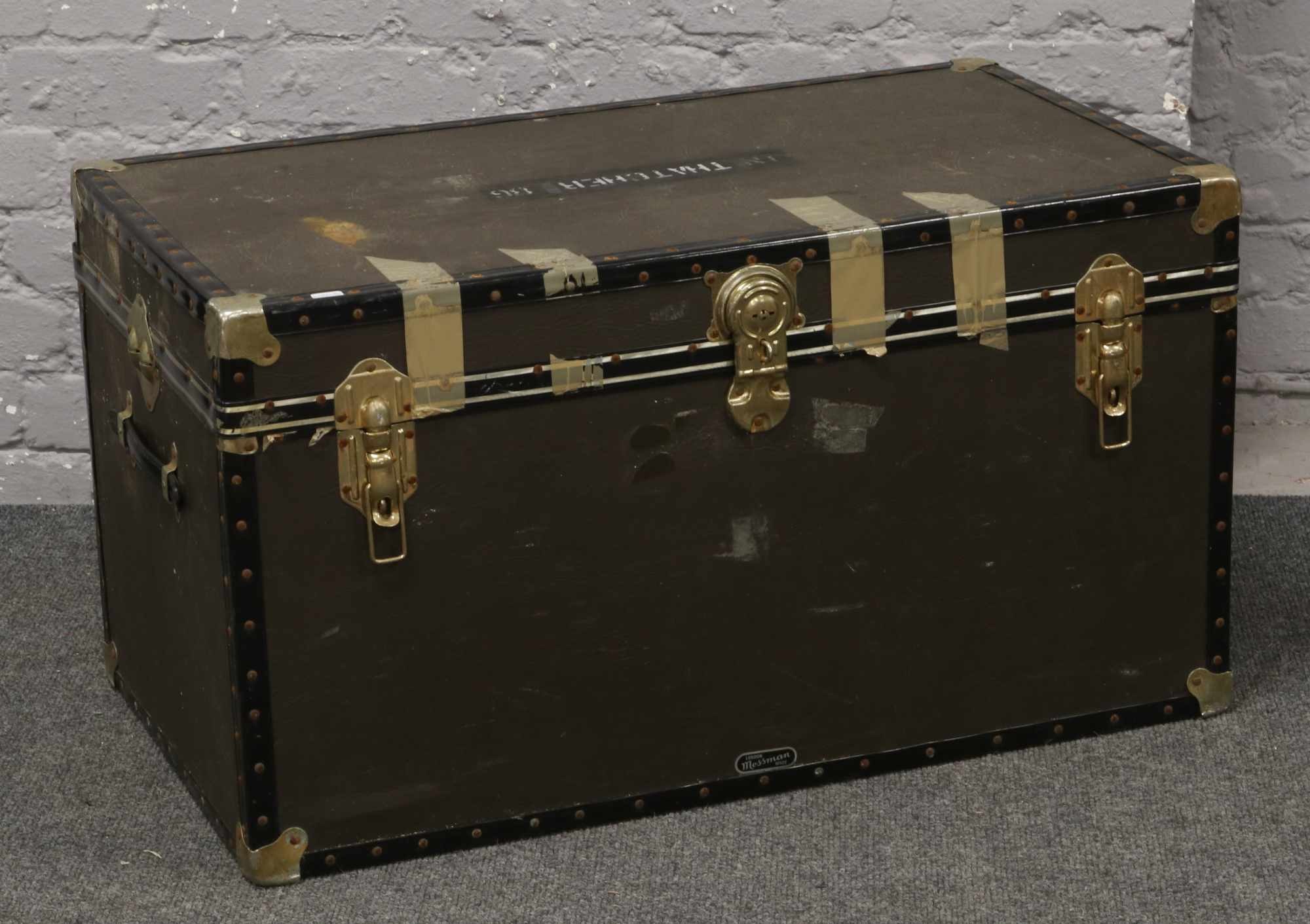 A vintage vinyl bound steamer trunk.