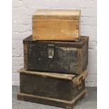 Three wooden tool chests.