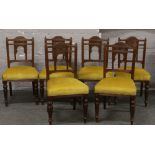A set of six Victorian carved mahogany salon chairs.