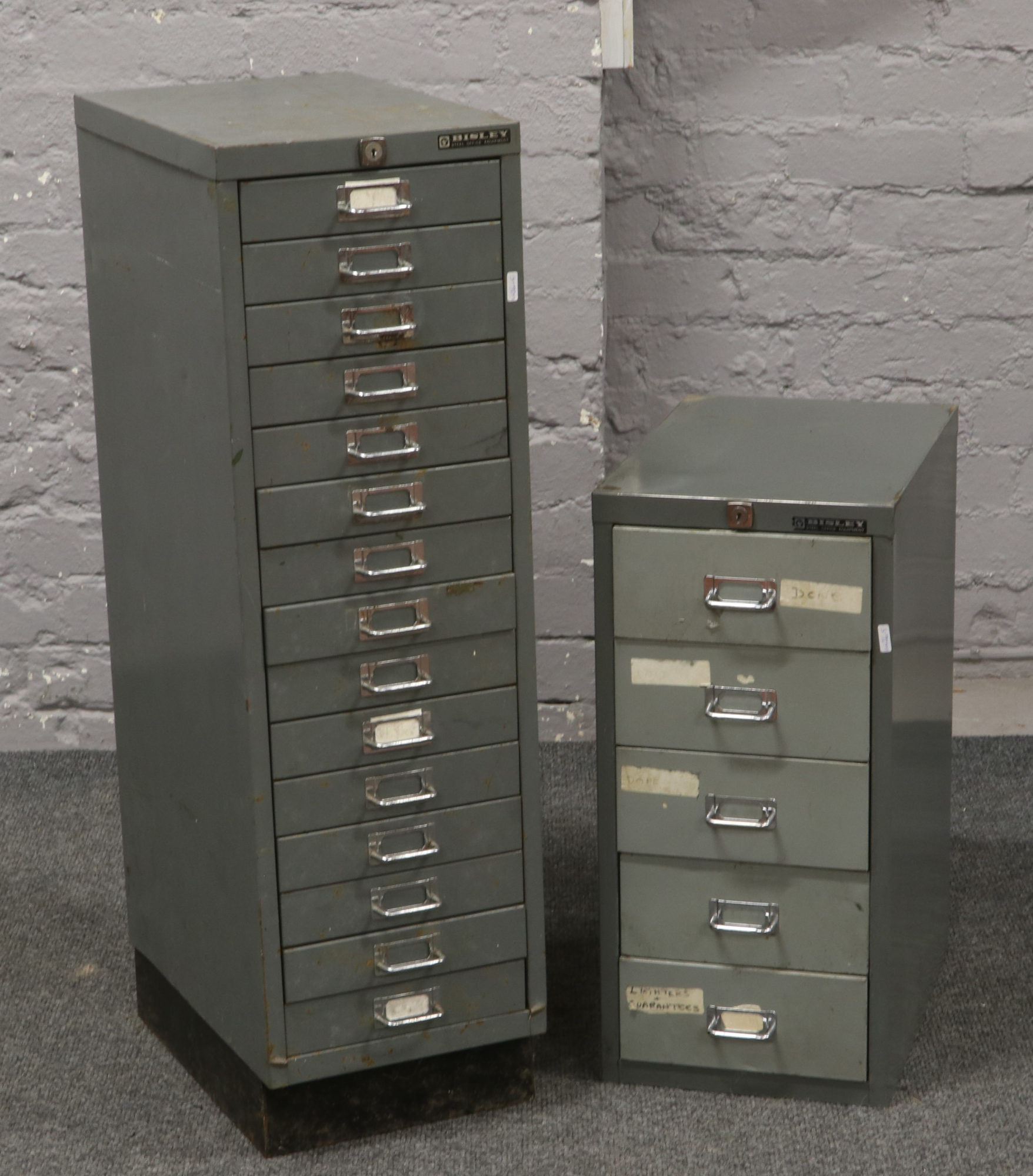 A Bisley steel office fifteen drawer filing cabinet and a five drawer example.