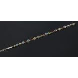 A 9ct gold diamond and multi gem bracelet, 5.2 grams. 20cm.Condition report intended as a guide