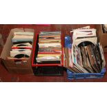 Three boxes of 45rpm singles mainly pop music with picture sleeves.