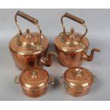 Two 19th century copper kettles and a pair of copper cooking pots with covers.