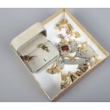 A box of assorted gold plated cufflinks.
