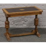 An oak refectory style occasional table.