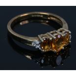 A 9ct gold citrine and diamond ring. With certificate, size N.