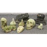 A group lot of cast concrete garden ornaments to include Betty Boop, skull, toad, grotesque face