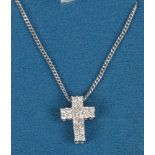 A 9ct white gold and diamond cross pendant on chain, 5.4 grams.