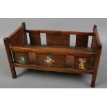 A wooden dolls crib with Disney's seven dwarfs decoration.