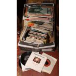A box of sheet music to include 45rpm singles mainly pop music with picture sleeves.
