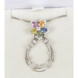 An 18ct white gold multi gem and diamond pendant on chain. Formed as a pansy and with an articulated