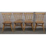 A set of four Ercol elm candlestick lattice dining chairs.