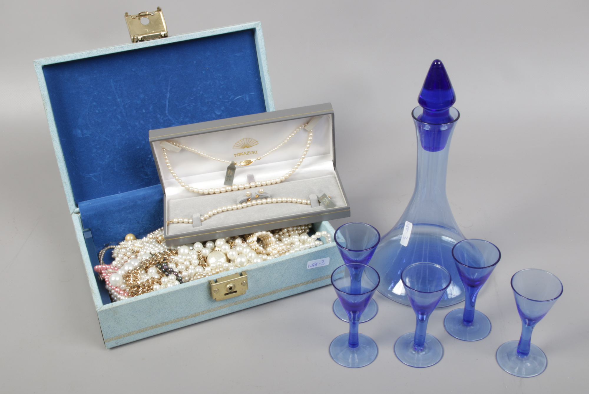 A jewellery box and assorted simulated pearls including a cased suite of Mikazuki pearls and a