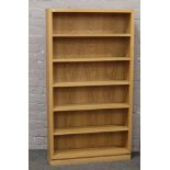 A modern light oak bookcase, 144 x 79 x 19cm.