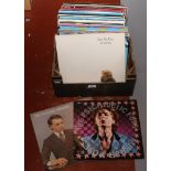 A box of L.P and single records to include Gary Numan, Rod Stewart, Yazoo etc.
