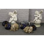 A collection of garden ornaments and planters to include pair of cherubs, rabbits etc.