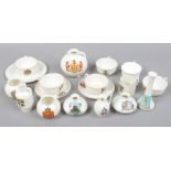 A box of assorted Goss crested china.