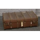 A vintage wood bound steamer trunk, RAF spitfire connection with a partial label to the base.