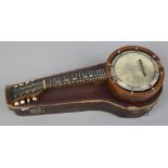 A cased eight string banjolele.