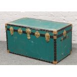 A vintage canvas bound steamer trunk.