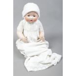 An Armand Marseille dream baby bisque head doll with jointed composite baby.Condition report