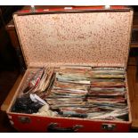 A vintage suitcase and contents of 1960s 45rpm single records mainly in original sleeves to