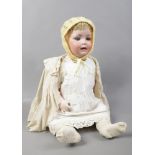 A German bisque head doll with jointed composite body, marked PM for Porzellanfabrik