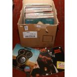 A box of L.P records to include AC DC, The Jam, David Bowie etc.