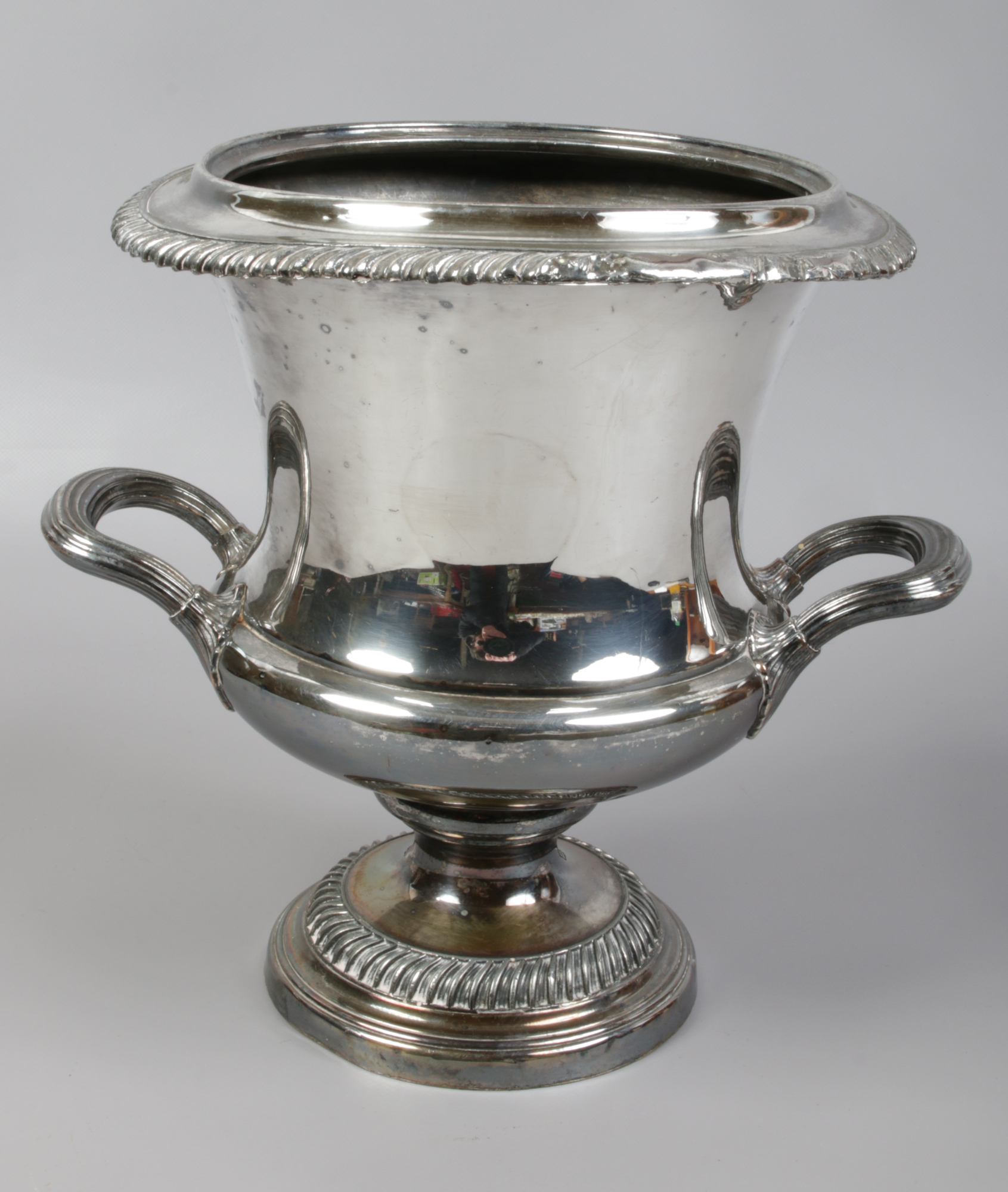 A 19th century silver plated wine cooler of campana form and with gadrooned mouldings.