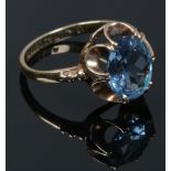 A 9ct gold dress ring set with a blue gem stone, assayed Birmingham 1970, size L1/2.