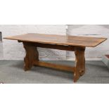 A carved oak refectory table 193cm x 89cm.
