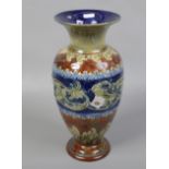 A Doulton Lambeth stoneware vase of baluster form, decorated with sprigged mouldings on a mottled