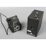 Two vintage cameras. An Ensign E29 portrait box camera and a Ful - Vue super box camera.