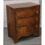 A Queen Anne style walnut bachelors chest of serpentine form, crossbanded with brushing slide and