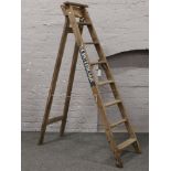 Bratts Ladders, a wooden 8 tread folding step ladder, stencilled Electrician.