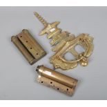 A cast metal Pagoda and monkey door knocker, large brass comet door hinge and a similar bi-fold
