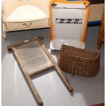 A basketware fishing creel, a French enamel wall mounting vanity stand and a rubbing board.