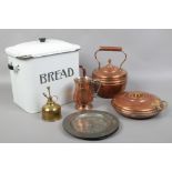 A collection of metalwares and an enamel bread bin.