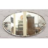 A decorative oval bevel edge wall mirror, 72cm x 40cm.