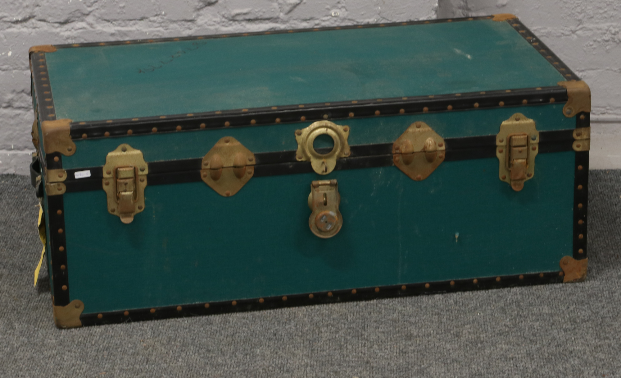 A vintage canvas bound steamer trunk.