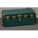 A vintage canvas bound steamer trunk.