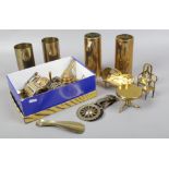 A collection of brassware including trench art, apprentice models and horse brasses etc.