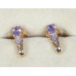 A pair of 10ct gold diamond and tanzanite ear studs. With certificate.