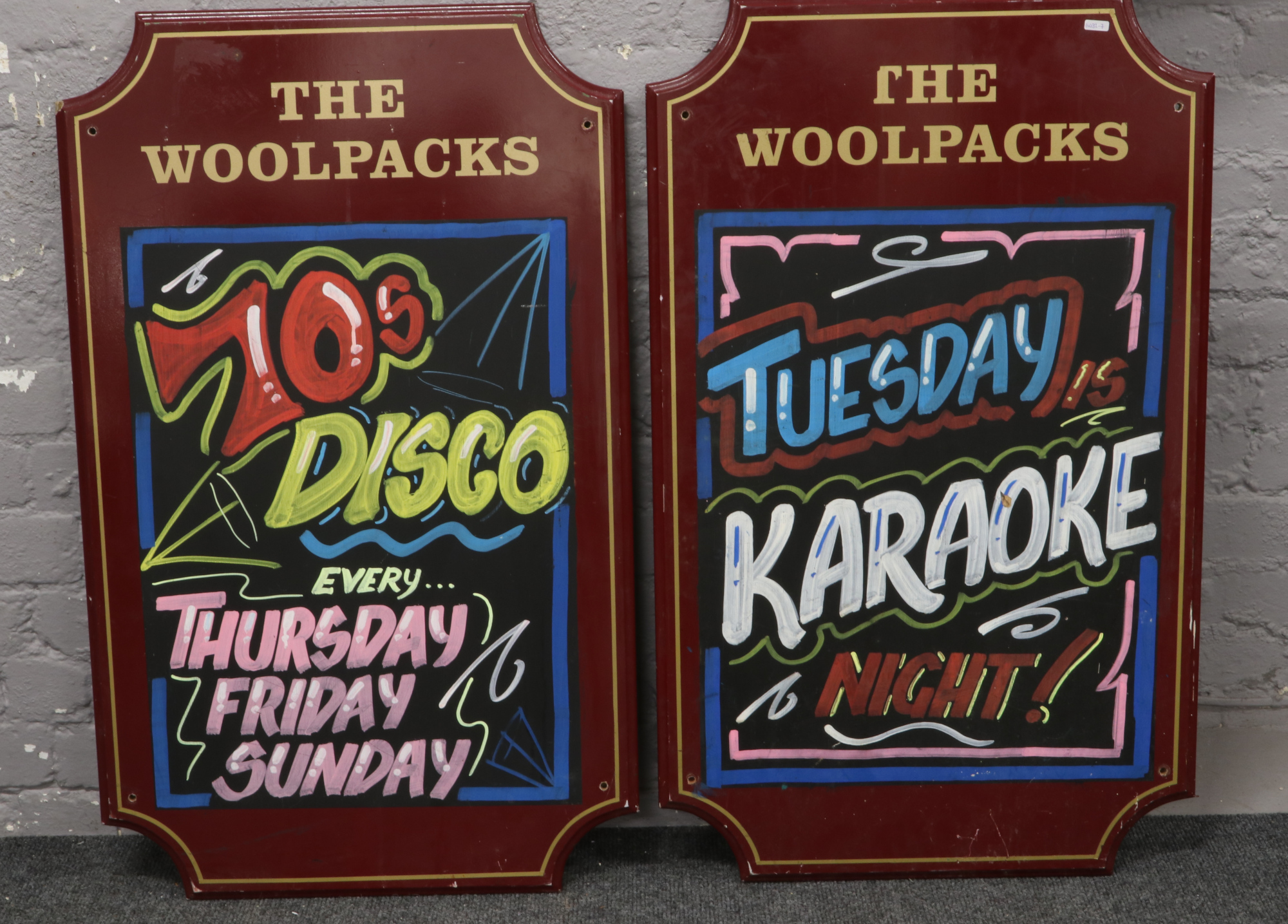 The Woolpacks, two pub advertising signs.