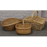 A basket ware hamper, laundry basket plus one other.